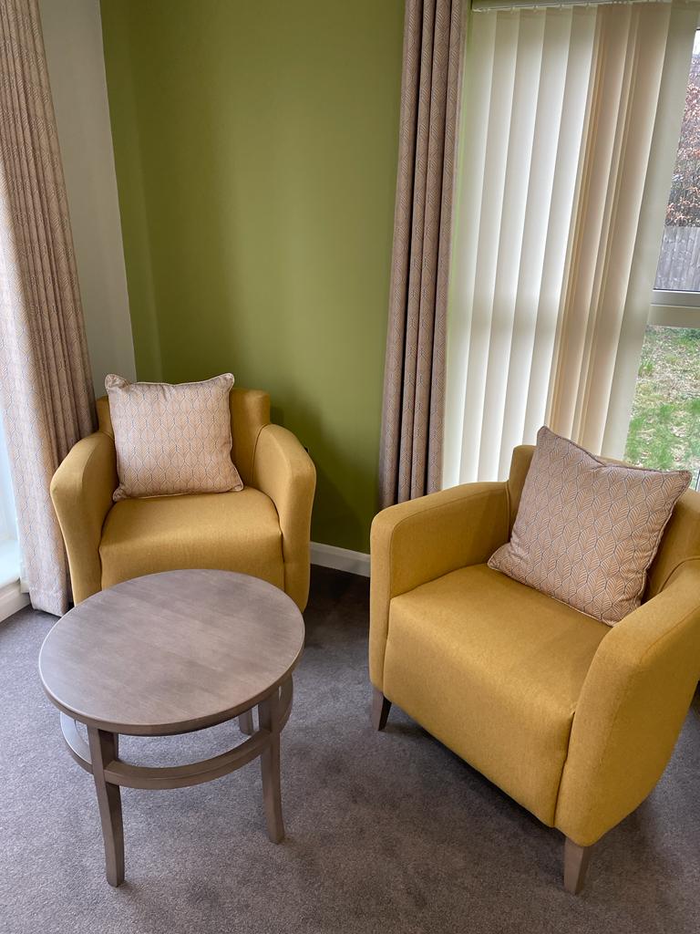 Bright and welcoming living room at Heathy House, providing a comfortable communal space for residents in a supportive mental health service in Halifax.