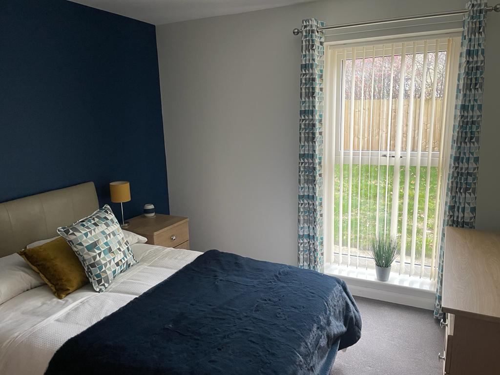 Comfortable and private resident bedroom at Heathy House, a specialist residential mental health service in Halifax.